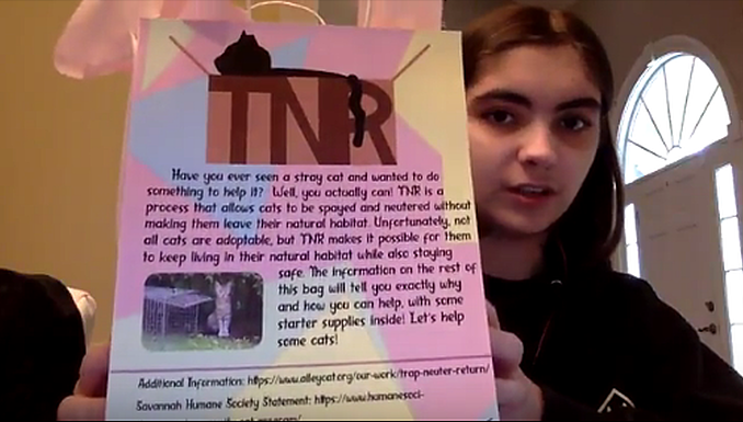 Image of a student explaining a piece of work.